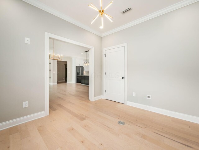3311 Polden Hill Dr Unit 24, New Albany, OH 43054 - spare room with a chandelier, ornamental molding, and light wood-type flooring