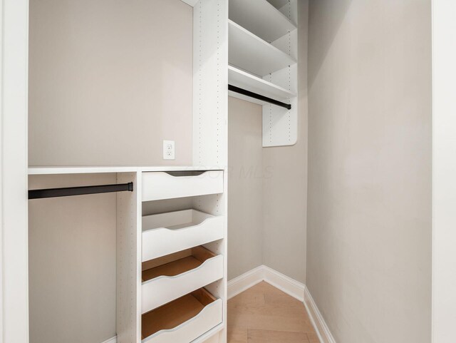 3311 Polden Hill Dr Unit 24, New Albany, OH 43054 - walk in closet featuring wood finished floors