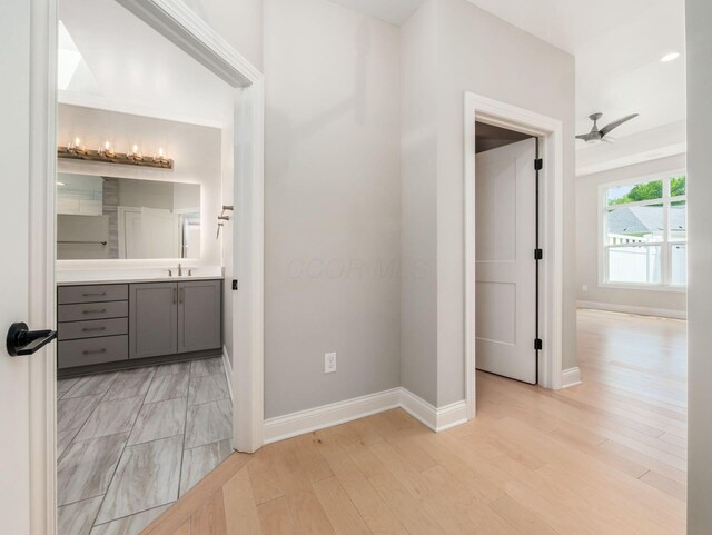 3311 Polden Hill Dr Unit 24, New Albany, OH 43054 - hallway featuring a sink and light wood-style floors