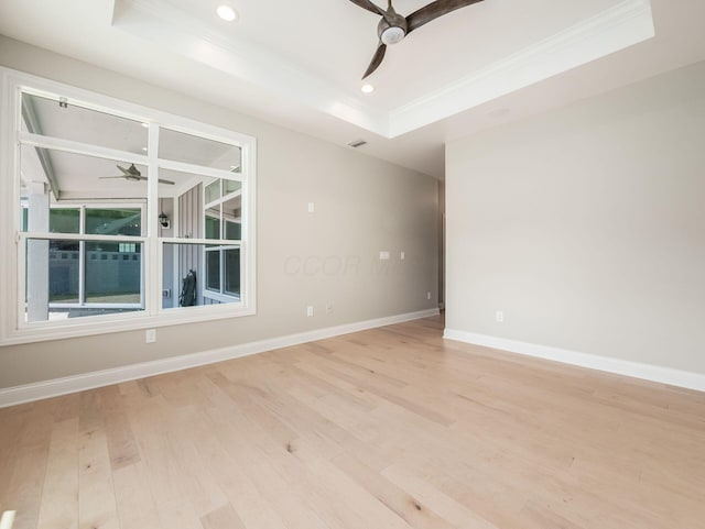 3311 Polden Hill Dr Unit 24, New Albany, OH 43054 - spare room with ceiling fan, a raised ceiling, crown molding, light wood-style flooring, and recessed lighting
