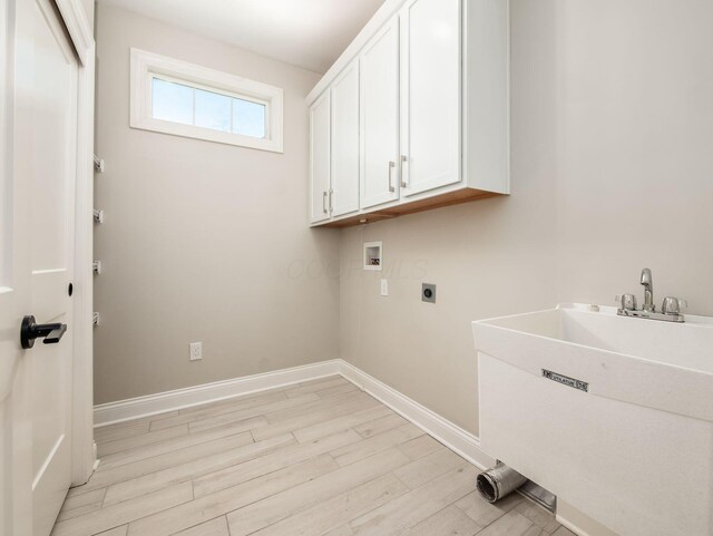3311 Polden Hill Dr Unit 24, New Albany, OH 43054 - laundry area featuring hookup for an electric dryer, washer hookup, cabinet space, and light wood finished floors