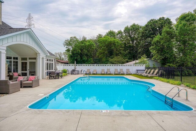 3311 Polden Hill Dr Unit 24, New Albany, OH 43054 - view of swimming pool with a patio, a fenced backyard, and an outdoor living space