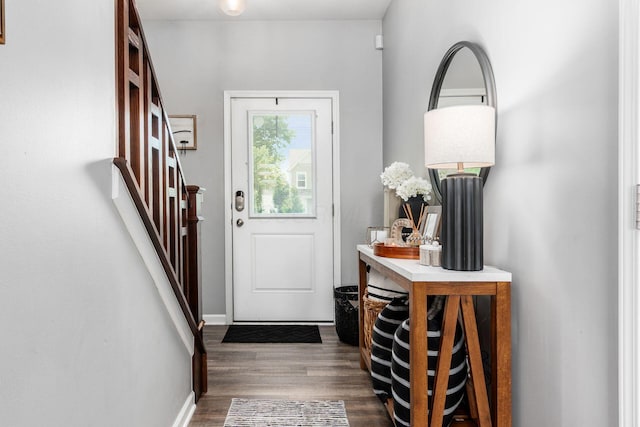 7036 Cannon Dr, Canal Winchester, OH 43110 - entryway with dark wood-style floors and stairway
