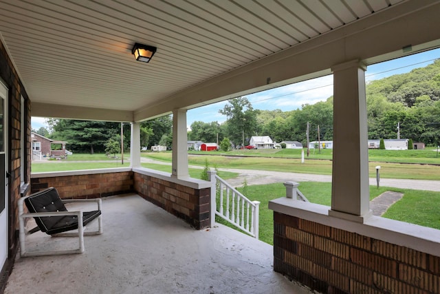 16703 Watkins Rd, Haydenville, OH 43127 - porch featuring a lawn and view of scattered trees