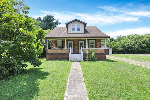 16703 Watkins Rd, Haydenville, OH 43127 - bungalow-style home with a porch and a front yard