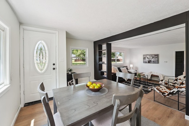 1366 Brown Rd, Columbus, OH 43223 - dining room featuring light wood finished floors and a textured ceiling