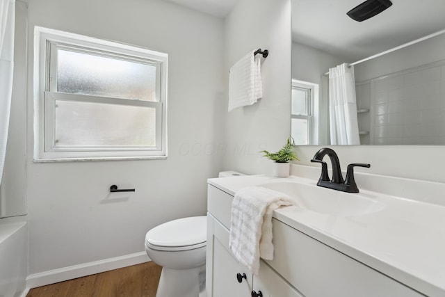 1366 Brown Rd, Columbus, OH 43223 - full bath featuring vanity, curtained shower, and wood finished floors