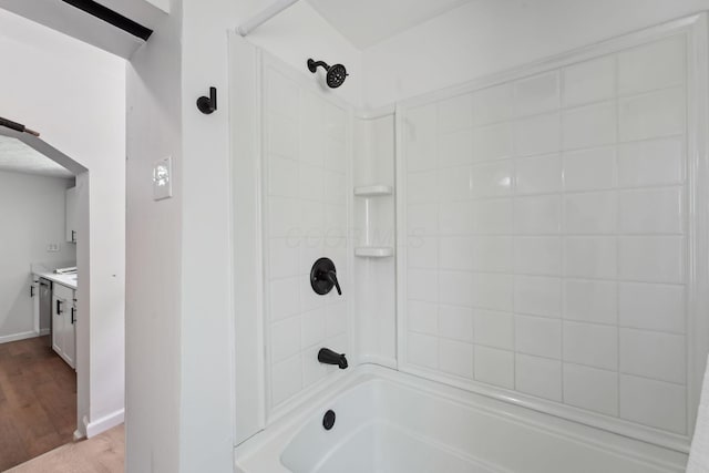 1366 Brown Rd, Columbus, OH 43223 - bathroom with tub / shower combination, vanity, and wood finished floors