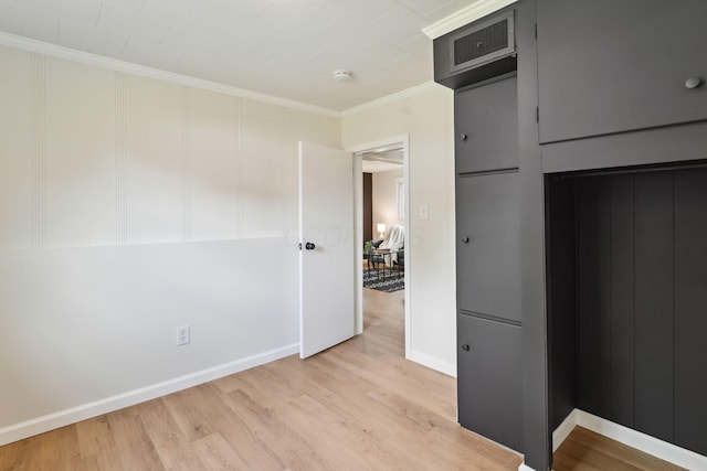 1366 Brown Rd, Columbus, OH 43223 - unfurnished bedroom with light wood-style floors and crown molding