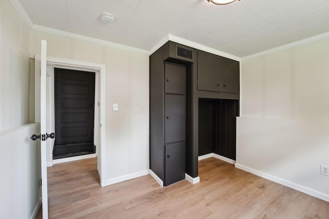 1366 Brown Rd, Columbus, OH 43223 - unfurnished bedroom featuring light wood-style flooring, ornamental molding, and a closet