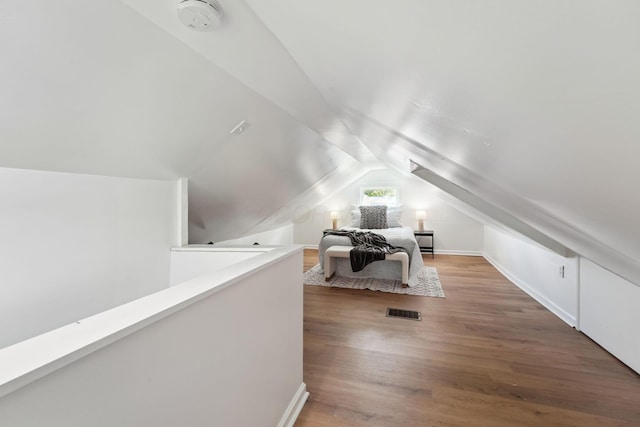 1366 Brown Rd, Columbus, OH 43223 - bedroom with vaulted ceiling and wood finished floors