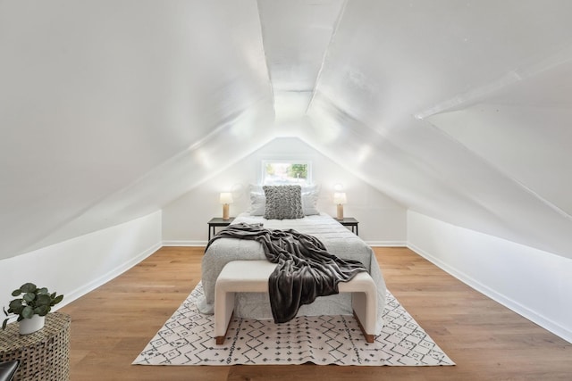 1366 Brown Rd, Columbus, OH 43223 - bedroom with vaulted ceiling and wood finished floors