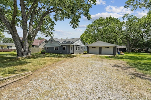 1366 Brown Rd, Columbus, OH 43223 - view of front facade with a garage and an outbuilding