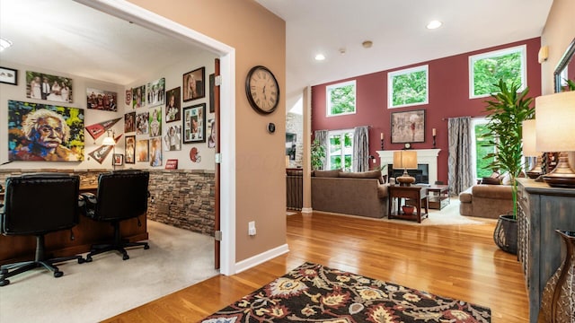 8933 Winding Creek Way, Pickerington, OH 43147 - office space featuring a glass covered fireplace, wood finished floors, and recessed lighting