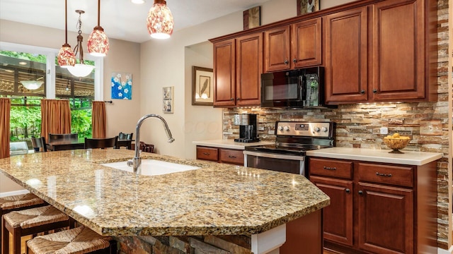 8933 Winding Creek Way, Pickerington, OH 43147 - kitchen featuring black microwave, electric range, a breakfast bar area, decorative backsplash, and light stone countertops