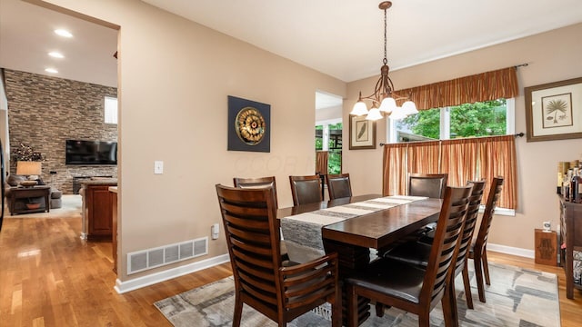 8933 Winding Creek Way, Pickerington, OH 43147 - dining area with light wood-style flooring, a chandelier, and recessed lighting
