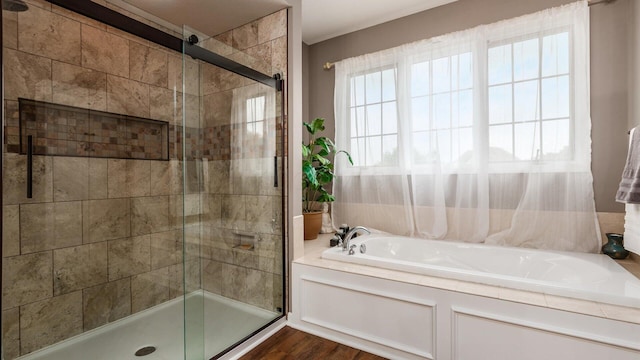 8933 Winding Creek Way, Pickerington, OH 43147 - full bathroom featuring a garden tub, a stall shower, and wood finished floors