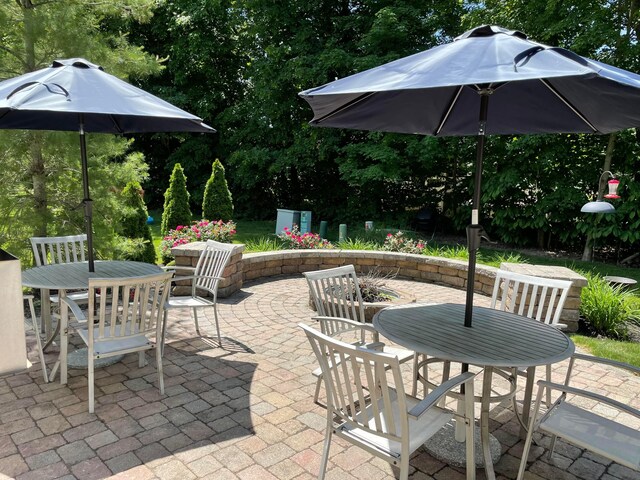 8933 Winding Creek Way, Pickerington, OH 43147 - view of patio / terrace featuring outdoor dining area and view of wooded area