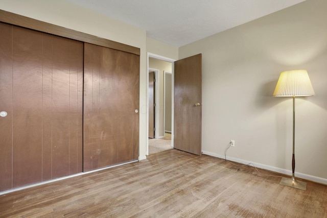 3905 Frazier Rd E, Columbus, OH 43207 - unfurnished bedroom with wood finished floors and a closet