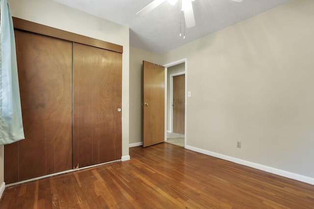 3905 Frazier Rd E, Columbus, OH 43207 - unfurnished bedroom with wood finished floors, a closet, and a ceiling fan