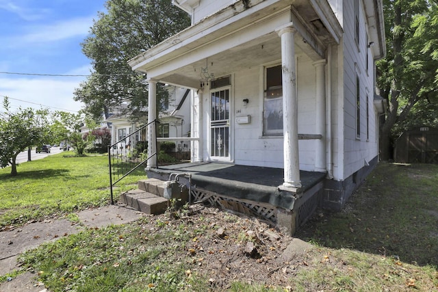 141 W Waterloo St, Canal Winchester, OH 43110 - view of exterior entry featuring a porch and a lawn