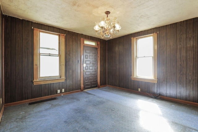 141 W Waterloo St, Canal Winchester, OH 43110 - empty room featuring a chandelier and carpet flooring