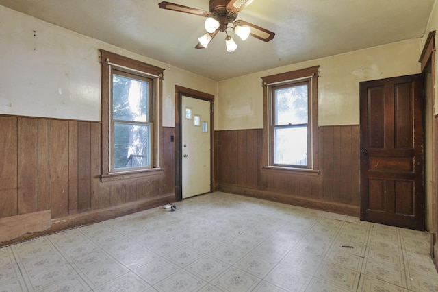 141 W Waterloo St, Canal Winchester, OH 43110 - foyer entrance featuring wainscoting, plenty of natural light, wooden walls, and ceiling fan