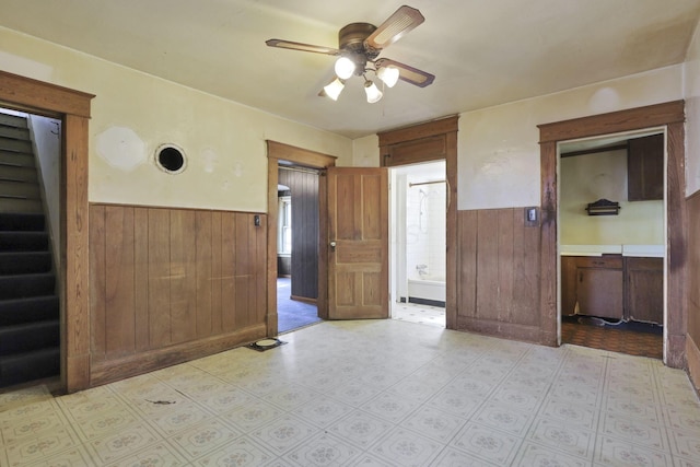 141 W Waterloo St, Canal Winchester, OH 43110 - unfurnished bedroom featuring a wainscoted wall, wood walls, and ensuite bathroom