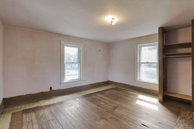 141 W Waterloo St, Canal Winchester, OH 43110 - unfurnished bedroom with wood-type flooring and multiple windows