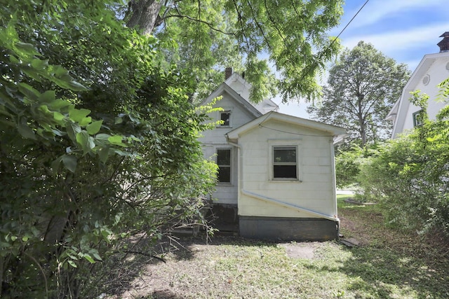 141 W Waterloo St, Canal Winchester, OH 43110 - view of property exterior featuring a chimney