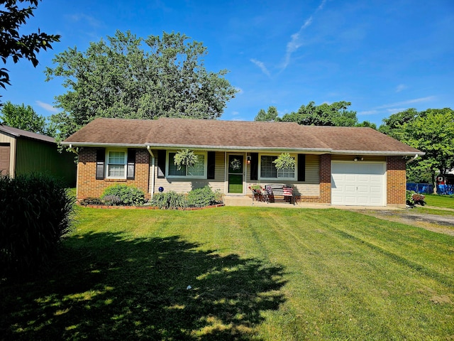 4999 Dickey Rd NE, Bloomingburg, OH 43106 - ranch-style home with brick siding, an attached garage, a front yard, and driveway