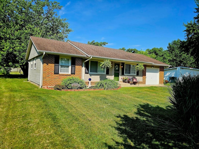 4999 Dickey Rd NE, Bloomingburg, OH 43106 - single story home featuring an attached garage, brick siding, a front lawn, and a porch