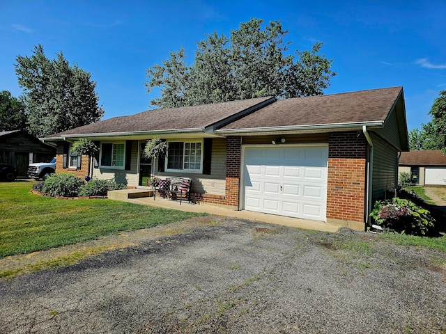 4999 Dickey Rd NE, Bloomingburg, OH 43106 - ranch-style house with a garage, brick siding, a front lawn, and driveway