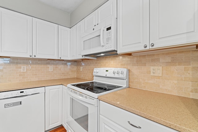 1211 Northport Dr, Columbus, OH 43235 - kitchen with white appliances, light countertops, white cabinetry, and decorative backsplash