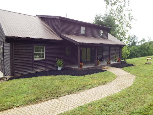 19448 Cr-80, Warsaw, OH 43844 - view of front of property featuring faux log siding, a front yard, and a metal roof
