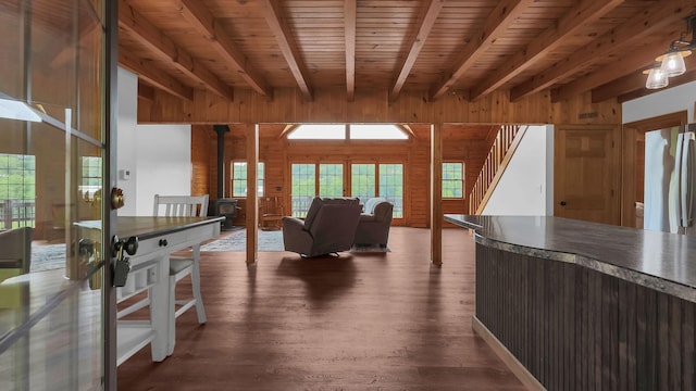 19448 Cr-80, Warsaw, OH 43844 - kitchen featuring wood walls, dark wood-style flooring, a wood stove, healthy amount of natural light, and a wood ceiling with exposed beams
