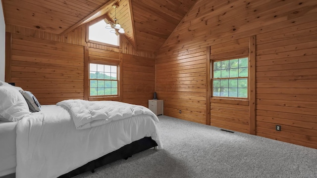19448 Cr-80, Warsaw, OH 43844 - carpeted bedroom featuring multiple windows, wood walls, vaulted ceiling, and wooden ceiling