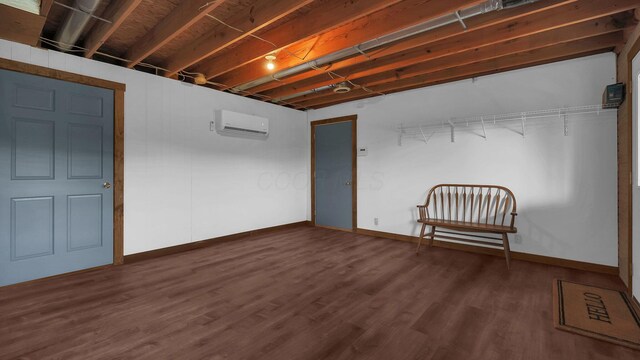19448 Cr-80, Warsaw, OH 43844 - finished below grade area with a wall mounted AC and dark wood-style floors