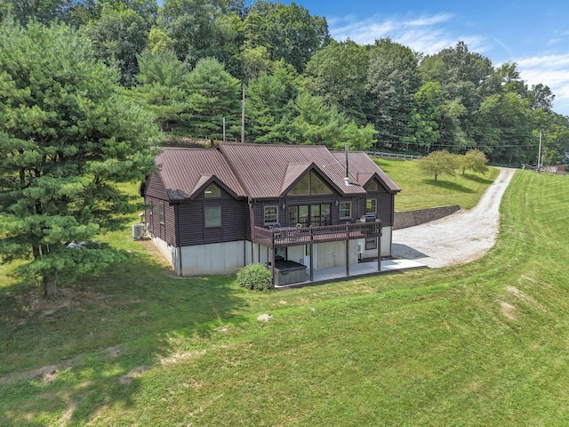 19448 Cr-80, Warsaw, OH 43844 - back of house featuring a yard, a patio area, a deck, and a metal roof
