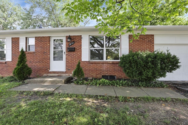 1850 Ormond Ave, Columbus, OH 43224 - ranch-style house featuring a garage, brick siding, and crawl space