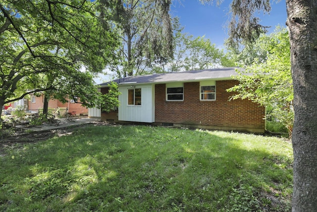 1850 Ormond Ave, Columbus, OH 43224 - view of side of home featuring brick siding and a lawn