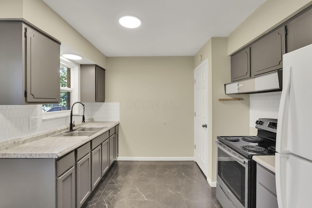 1850 Ormond Ave, Columbus, OH 43224 - kitchen featuring stainless steel electric stove, freestanding refrigerator, extractor fan, gray cabinets, and tasteful backsplash