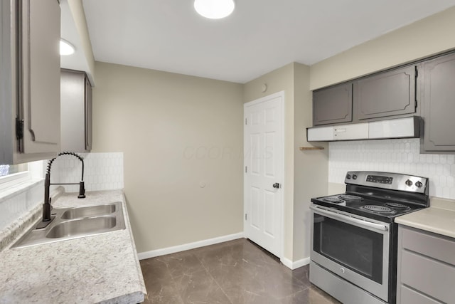 1850 Ormond Ave, Columbus, OH 43224 - kitchen with electric range, gray cabinetry, extractor fan, and tasteful backsplash