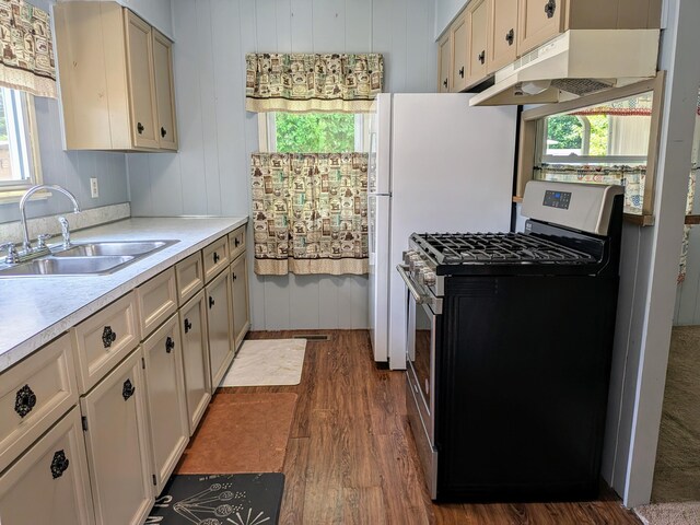 8927 Columbus Rd Lot 44, Mount Vernon, OH 43050 - kitchen with stainless steel gas stove, under cabinet range hood, dark wood finished floors, and light countertops