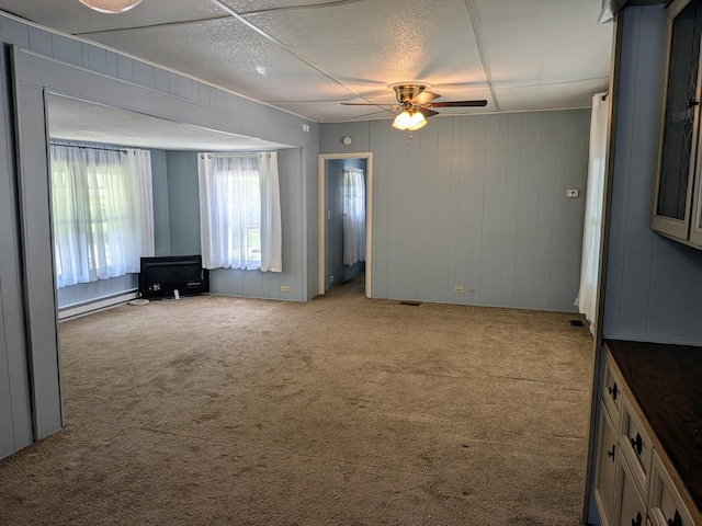 8927 Columbus Rd Lot 44, Mount Vernon, OH 43050 - carpeted spare room featuring a ceiling fan and baseboard heating
