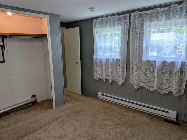 8927 Columbus Rd Lot 44, Mount Vernon, OH 43050 - unfurnished bedroom featuring a baseboard radiator, carpet, and a closet