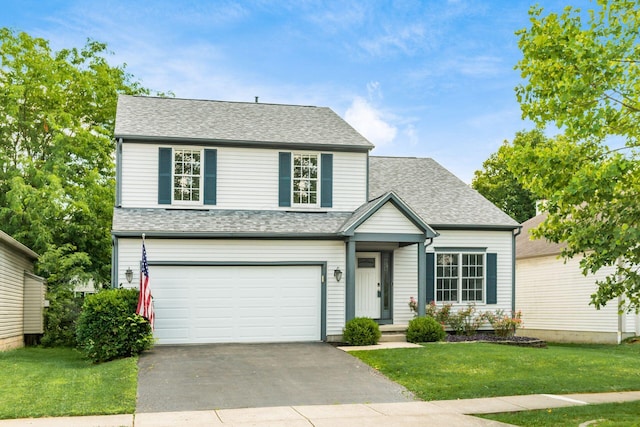 2378 Yagger Bay Dr, Hilliard, OH 43026 - traditional home featuring a garage, driveway, a front yard, and roof with shingles