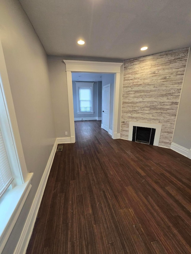1035 Sullivant Ave, Columbus, OH 43223 - unfurnished living room with wood finished floors, a fireplace, and recessed lighting