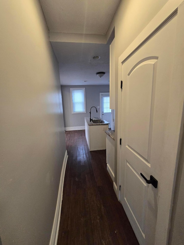 1035 Sullivant Ave, Columbus, OH 43223 - hallway featuring dark wood-style floors and a sink