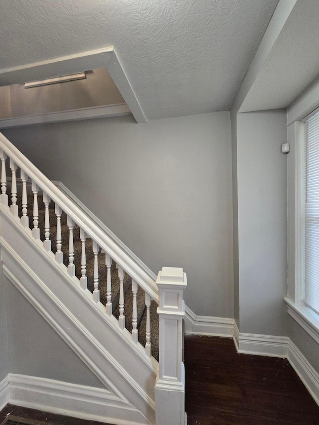 1035 Sullivant Ave, Columbus, OH 43223 - stairs featuring wood finished floors and baseboards